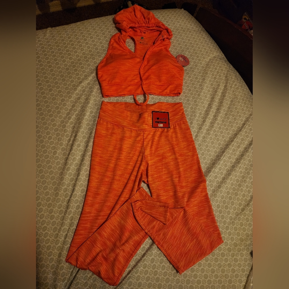 New Ladies Sports clothing set size small.  The top has a hoddie with tag. $17